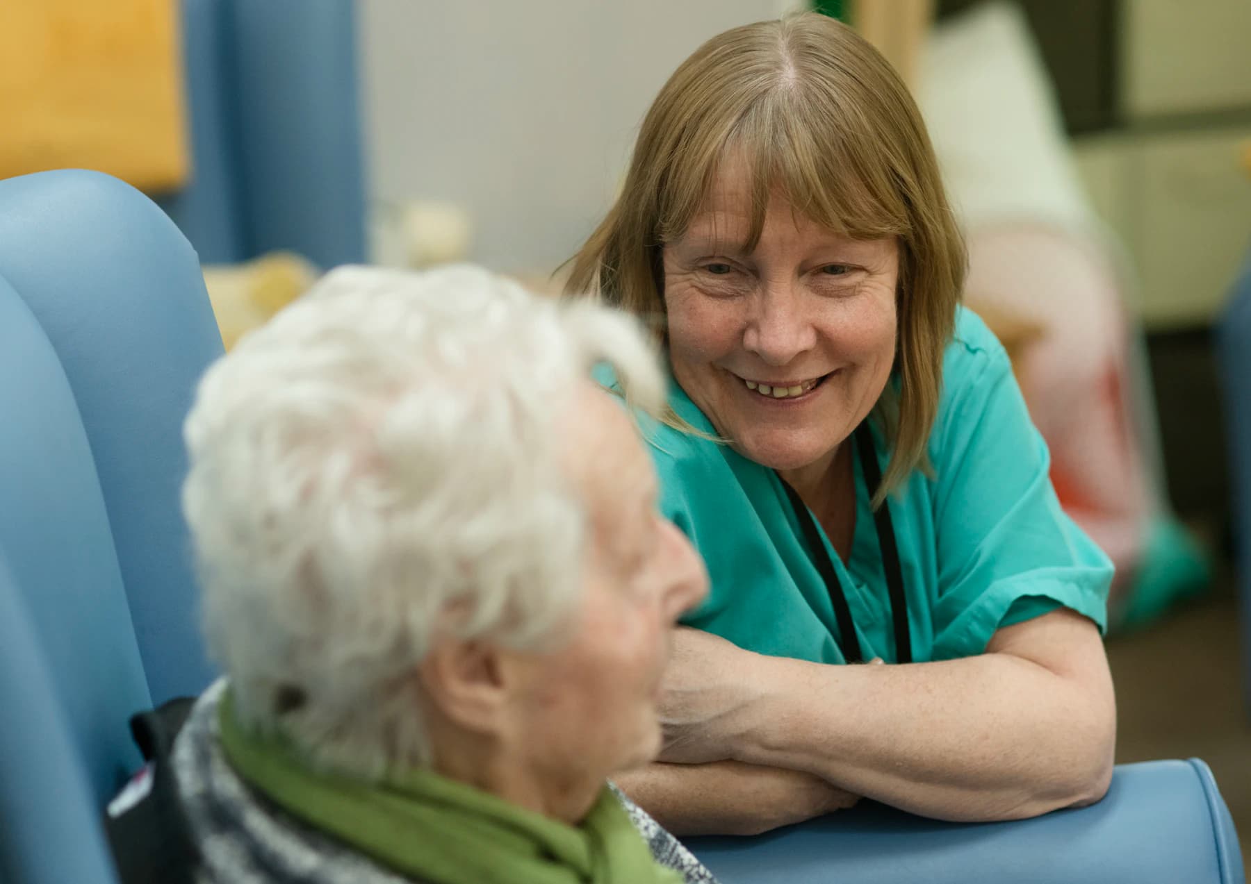 A care visit between a clinician and an older patient